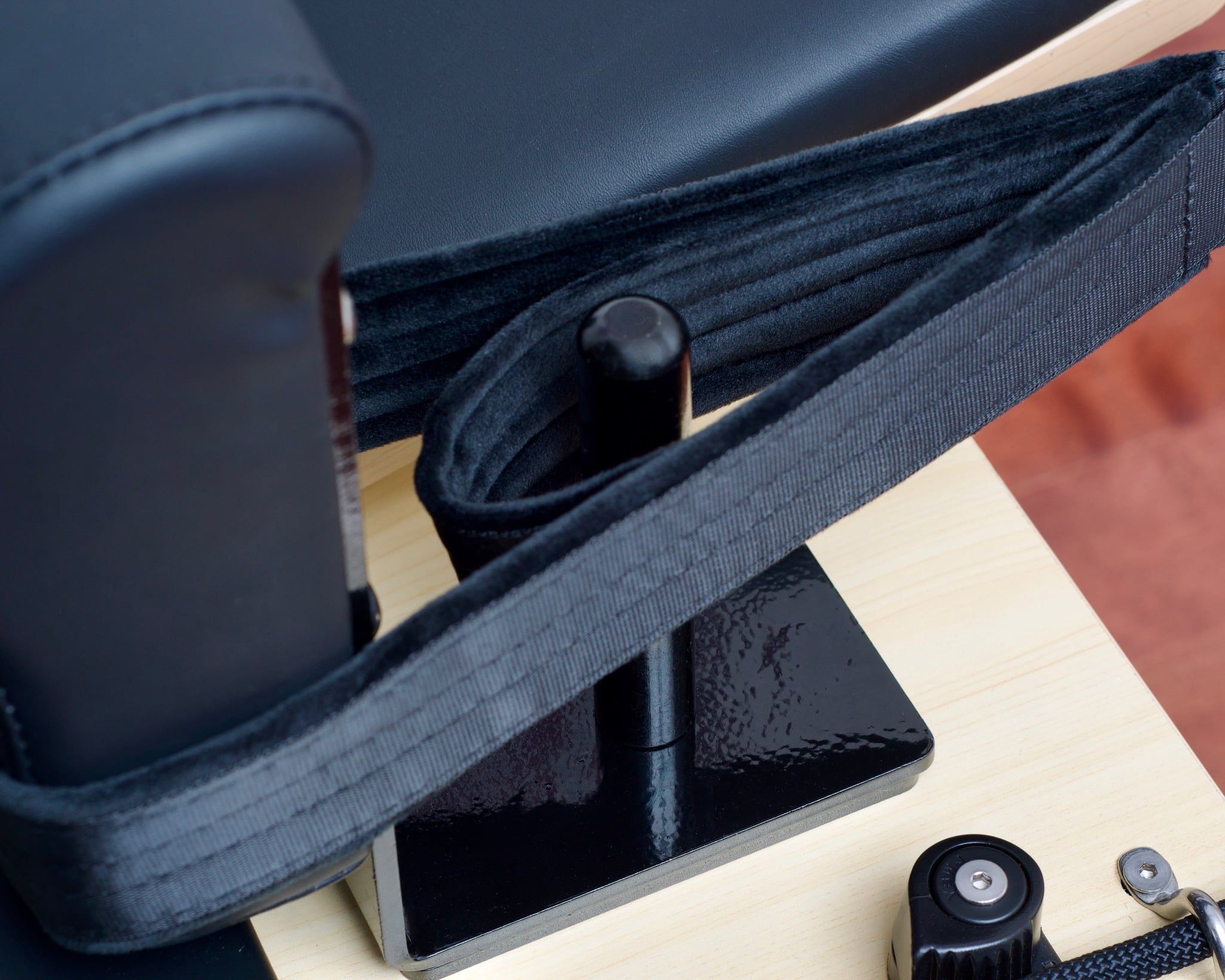 Closeup of the Maple Elite Studio Reformer With Tower ultra-soft double loop showing the soft texture of the loops.